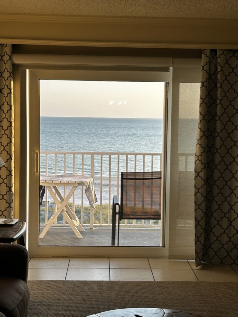 looking our the living room entrance onto the porch oceanfront in the Gulf of Mexico.